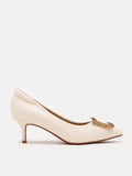 PAZZION, Adele Decollate Oversize Chrome Buckle Pumps, Beige